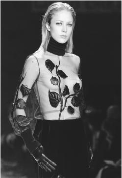 Laura Biagiotti, fall/winter 2001-02 collection: transparent chiffon top with leaf motif over satin pants. © AP/Wide World Photos.