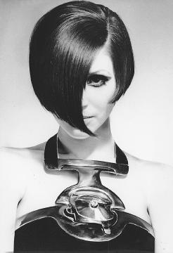 Pierre Cardin, spring 1968 collection: sculpted silver necklace with a $60,000 diamond built into the halter top of a crêpe evening gown. © AP/Wide World Photos.