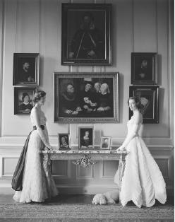 Lady Melissa and Lady Caroline Wyndham-Quinn modeling Sybil Connolly-designed evening gowns, 1954. © Norman Parkinson Limited/Fiona Cowan/CORBIS.