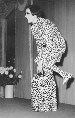 Rudi Gernreich, 1966 collection: ensemble in a cheetah print that includes coat, blouse, skirt, stockings, shoes, underwear, and helmet. © AP/Wide World Photos.