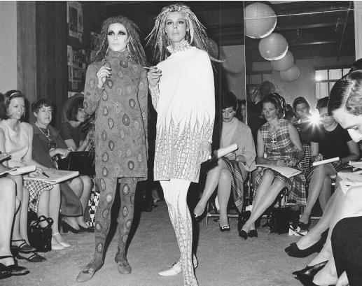 Rudi Gernreich, 1966 collection: jersey shifts with matching tights and feathered helmets in peacock (left) and a pheasant (right) patterns. (Mule shoes by Capezio.) © AP/Wide World Photos.