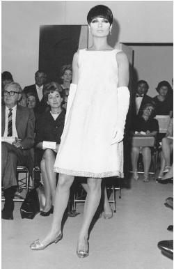 Pauline Trigére, fall 1966 collection: American broadtail dinner dress with a rhinestone border. © AP/Wide World Photos.
